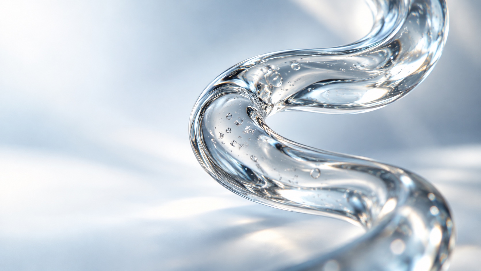 Clear sculptural glass fibre with a gently pinched curve and tiny suspended bubbles